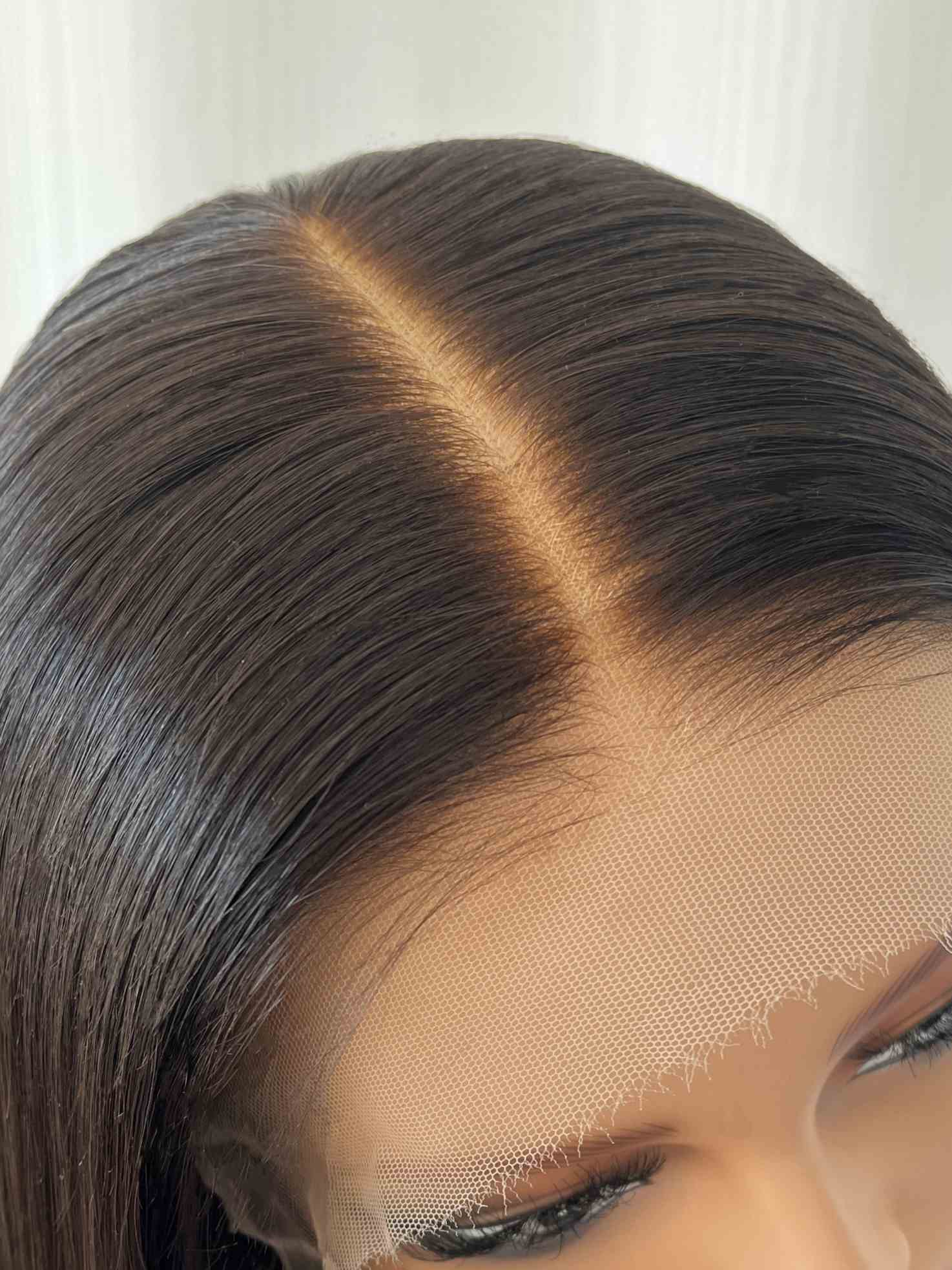 Top view of HD lace showing realistic scalp and parting options