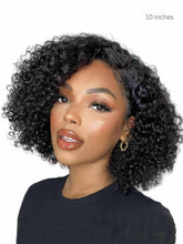 Model wearing 10 inch Cora curly bob wig in natural black – front view