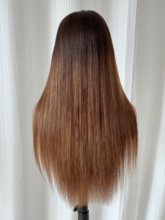 Back view of long ombre brown straight wig with sleek finish