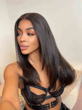 Model wearing Vivian 16-inch layered straight wig – front view, natural black