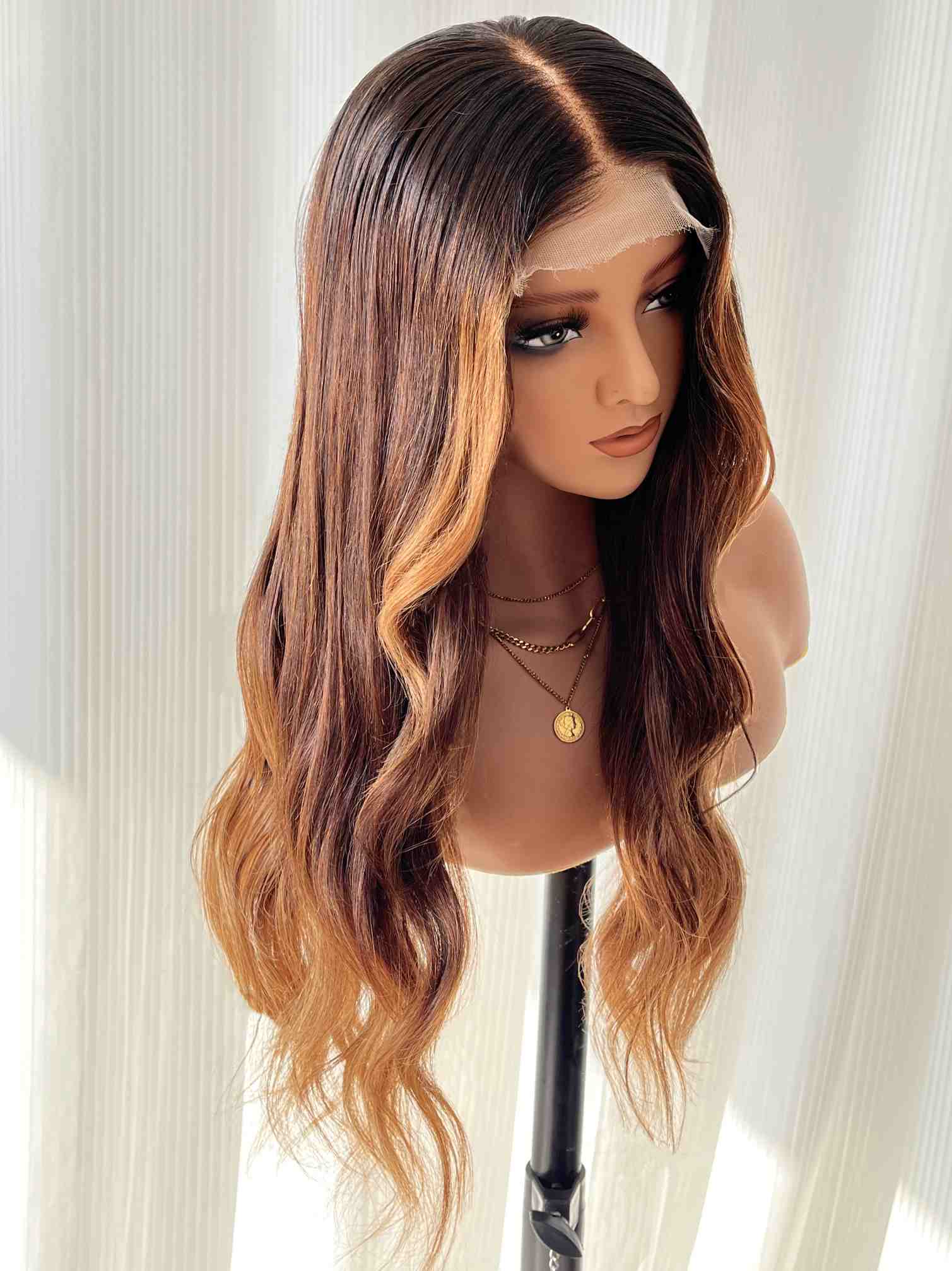 Angled view of brown wavy human hair wig showing natural color transition