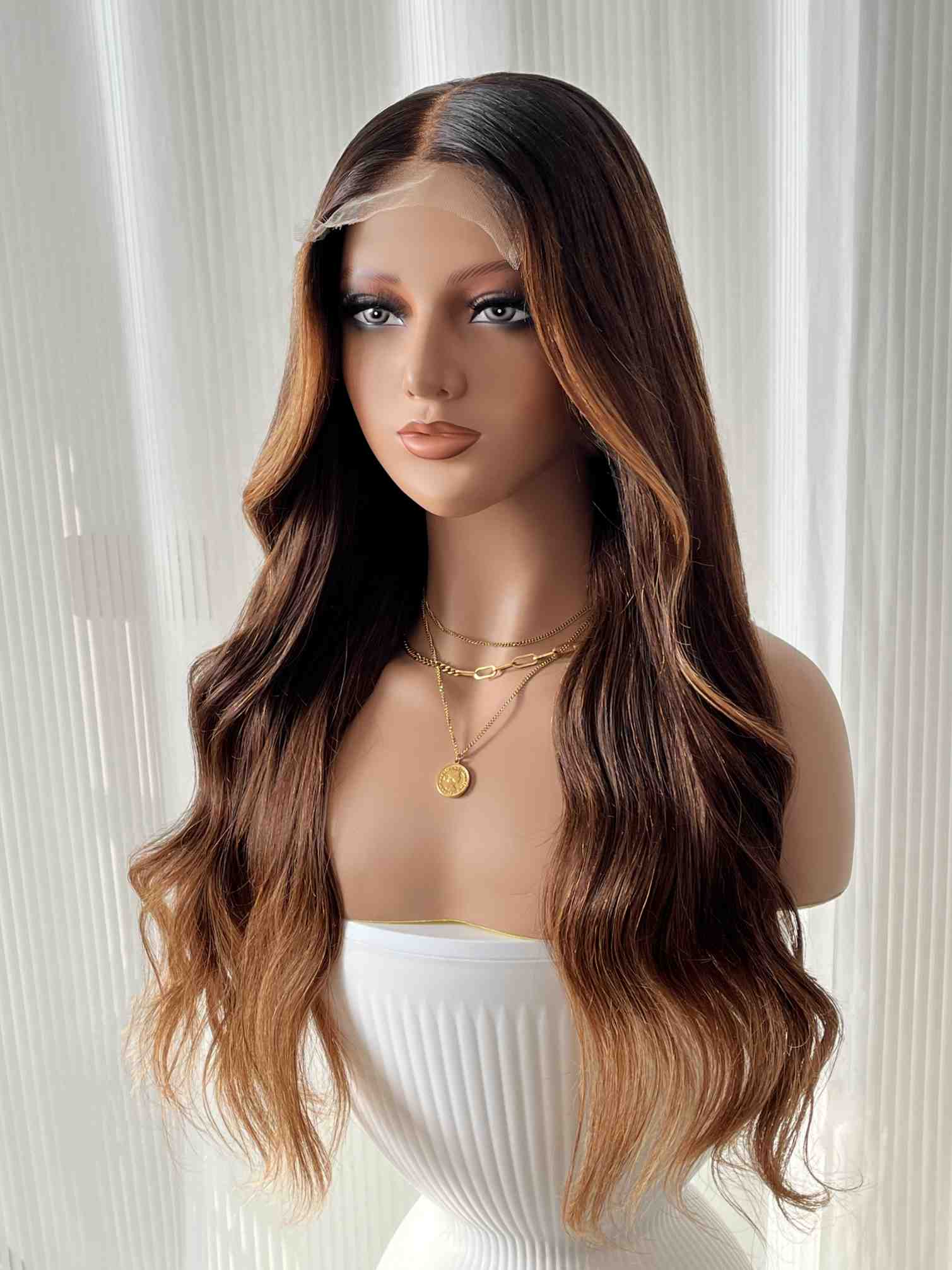 Left side view of glueless HD lace wig showing soft waves and highlights