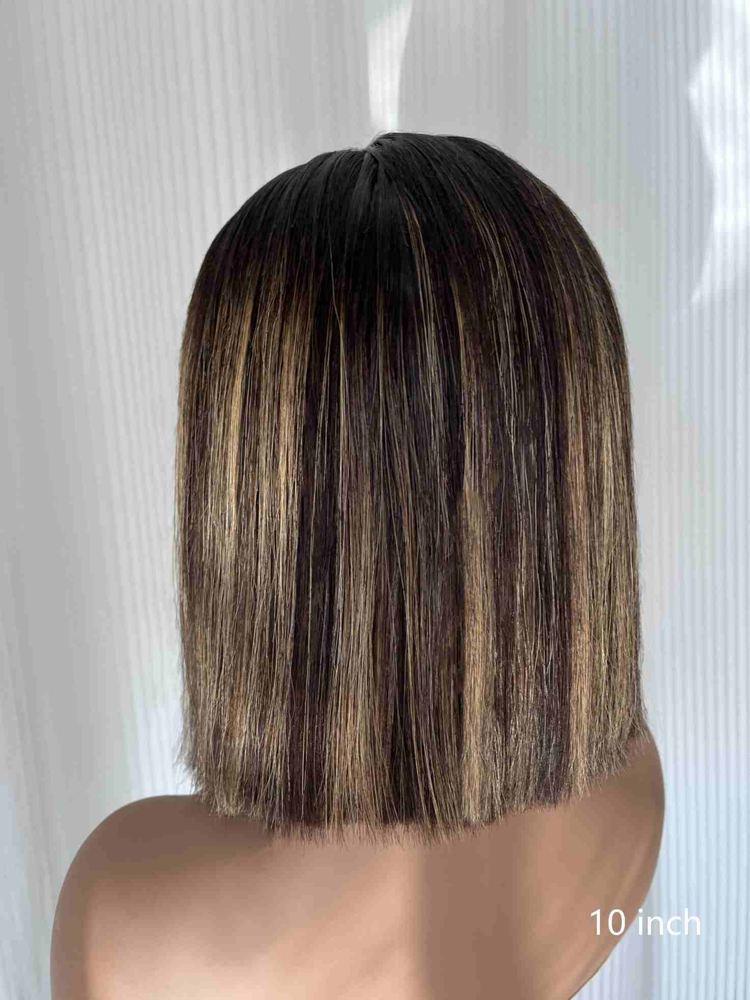 Back view of Aubrie 10 inch bob wig showing clean cut and natural volume