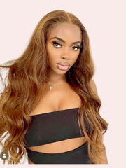 Model wearing Lily brown wavy wig with highlights – front view