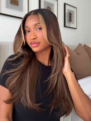 Model wearing Poppy straight brown human hair wig with blonde highlights