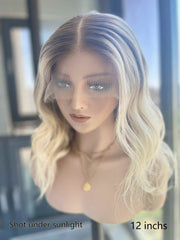 Aurora Blonde Short Wavy Wig 12 Inch – Left Side View on Mannequin in Sunlight | Ash Gray Root to Light Blonde