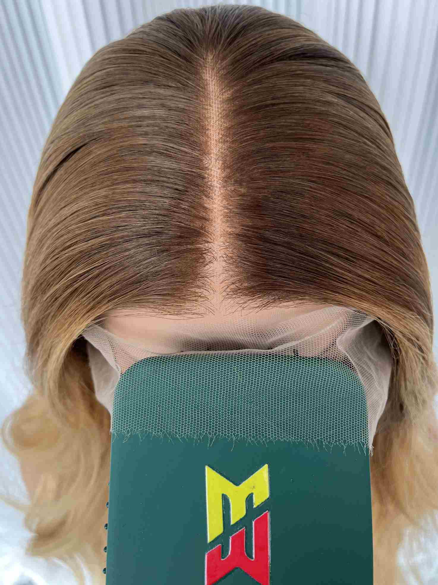 Close-up of wig bleach knots on top