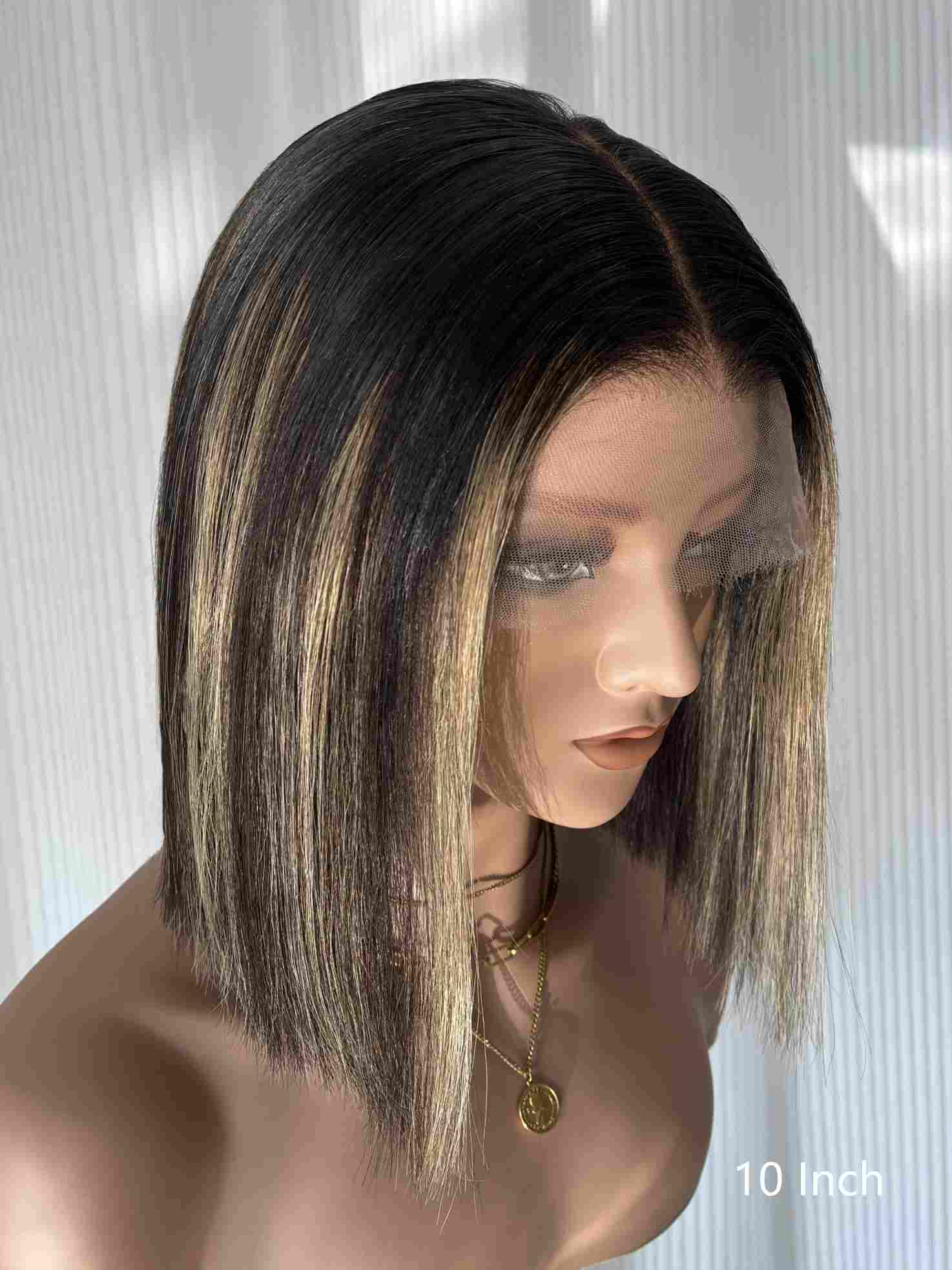 Right side view of Aubrie bob wig in brown blonde highlights on mannequin head