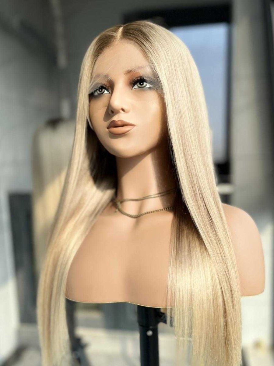 Amanda silver blonde wavy wig on model – ash brown roots natural hairline